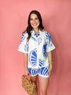 white set with blue seashells
