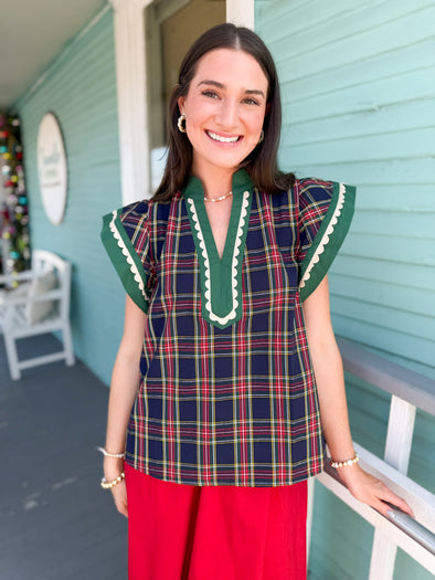 navy plaid top with green accents 