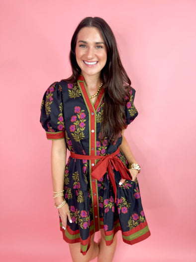 black and fuchsia floral dress with red and green accents 