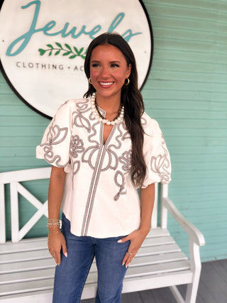 white thml top with brown embroidery