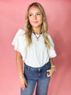 white top with ruffle sleeves
