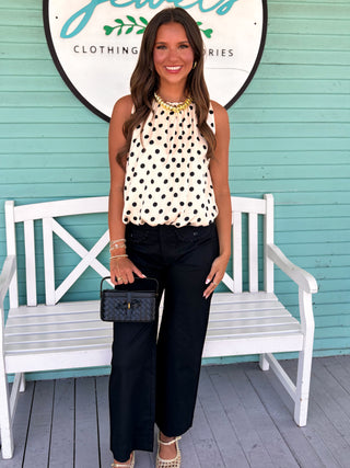 black straight leg pants with scallop pockets