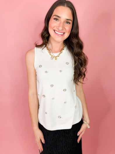 cream colored sleeveless top with rhinestones and pearls 