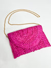 pink raffia clutch with gold chain 