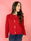 red cardigan with pearl buttons