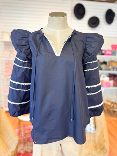 long sleeve navy top with ric rac trim 