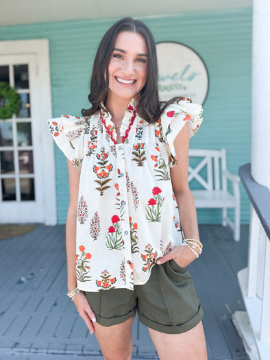 floral white sleeveless top with ruffles 