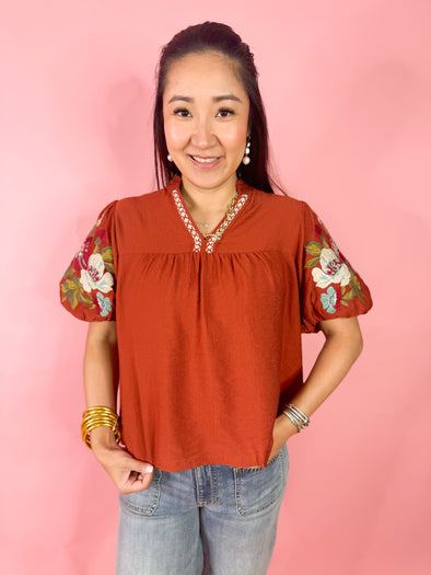 rust top with embroidery detail 