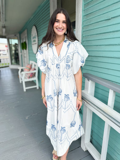 white dress with blue palm trees