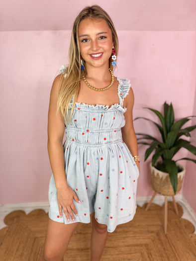 denim romper with floral design 