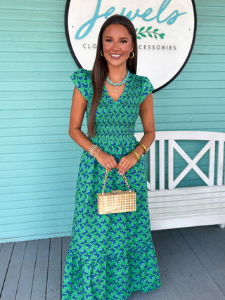 green dress with blue floral pattern 