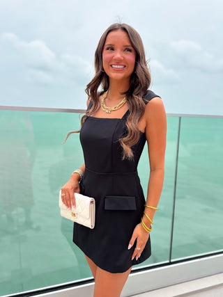 black romper with front flap pockets