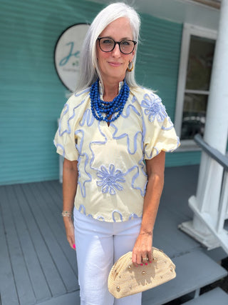 yellow top with ribbon floral detail 