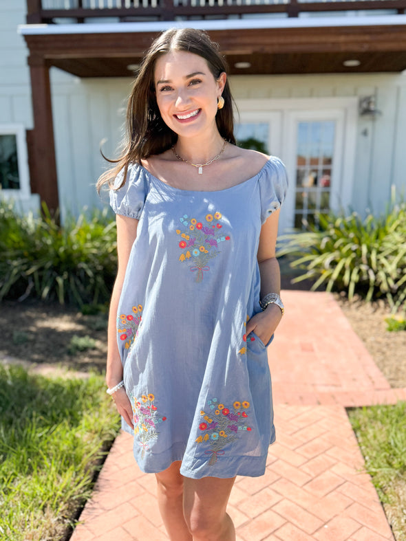 blue dress with embroidered flowers
