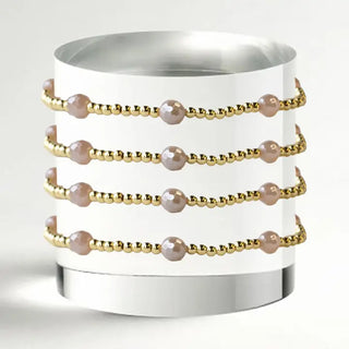 gold beaded bracelet with pink pearls 